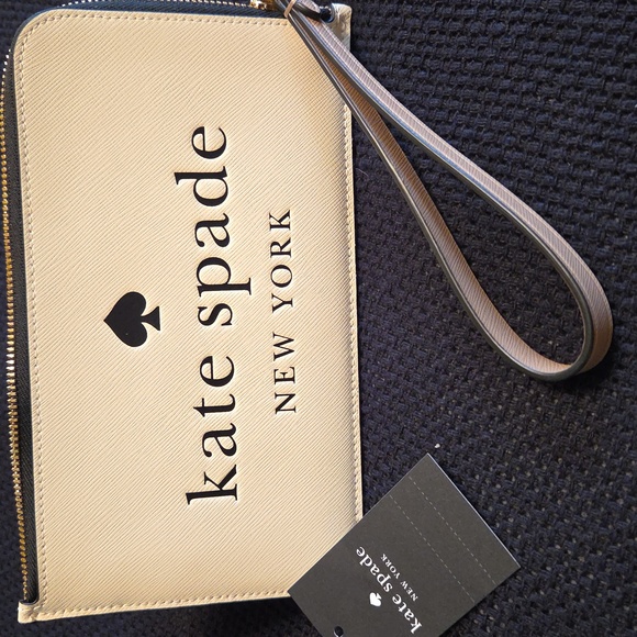 kate spade Handbags - Kate Spade NWT Cream & Tan Wristlet w/Black Logo